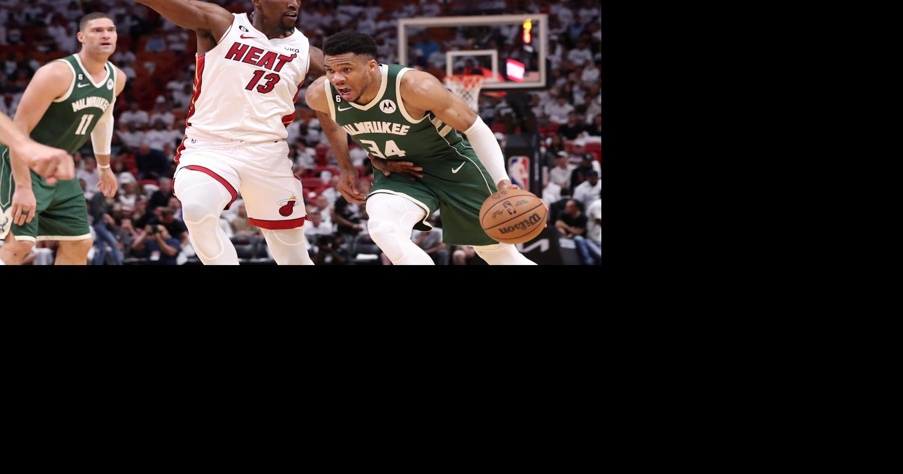 Milwaukee Bucks forward Giannis Antetokounmpo drives the ball while under pressure from Miami Heat center Bam Adebayo during the second half of Game 4 in a first-round NBA basketball playoff series at Kaseya Center on Monday, April 24, 2023, in Miami.