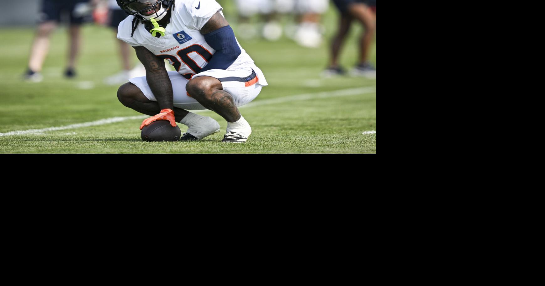 Jonah Coleman of the Denver Broncos squats during training camp at Broncos Park in Centennial, Colo., on Tuesday, Aug. 4, 2026.