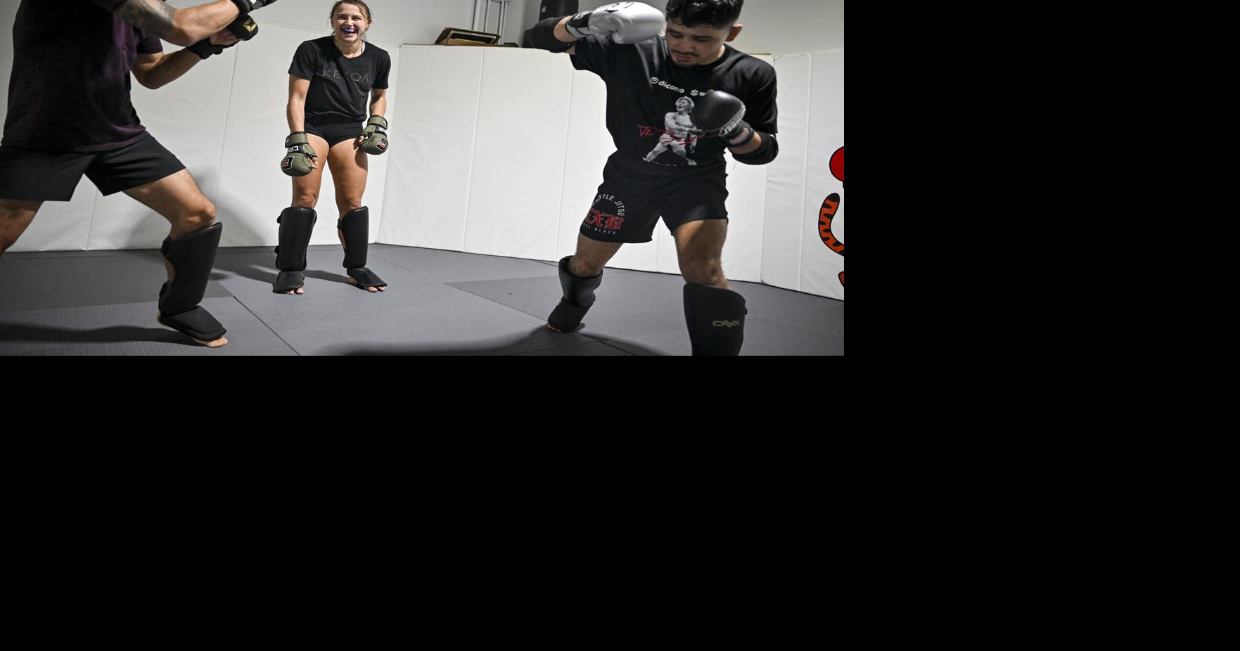 UFC fighter Alex Apodaca, middle, laughs as Milton Roque and Luis Gurrola work a technique during a training session at Tiger Beetle Martial Arts in Centennial, Colorado, on Sept. 9, 2026.