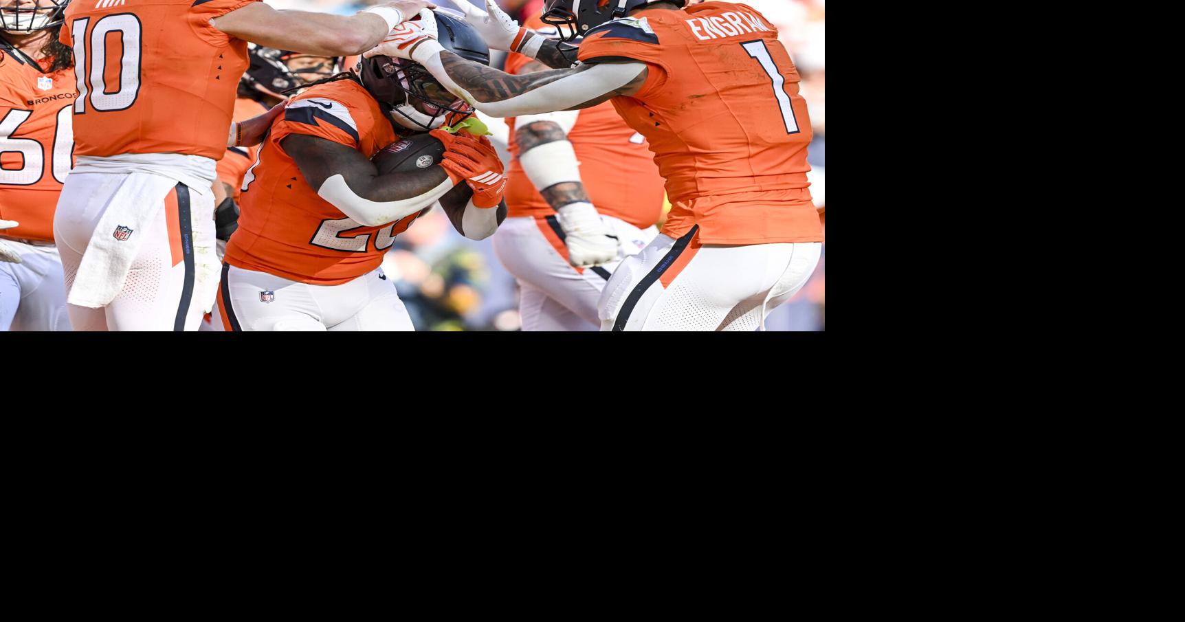 Bo Nix and Evan Engram of the Denver Broncos celebrate with Jonah Coleman after the rookie scored his first career touchdown during the fourth quarter of the Broncos’ 20-13 win at Empower Field at Mile High in Denver on Sunday, Sept. 20, 2026.