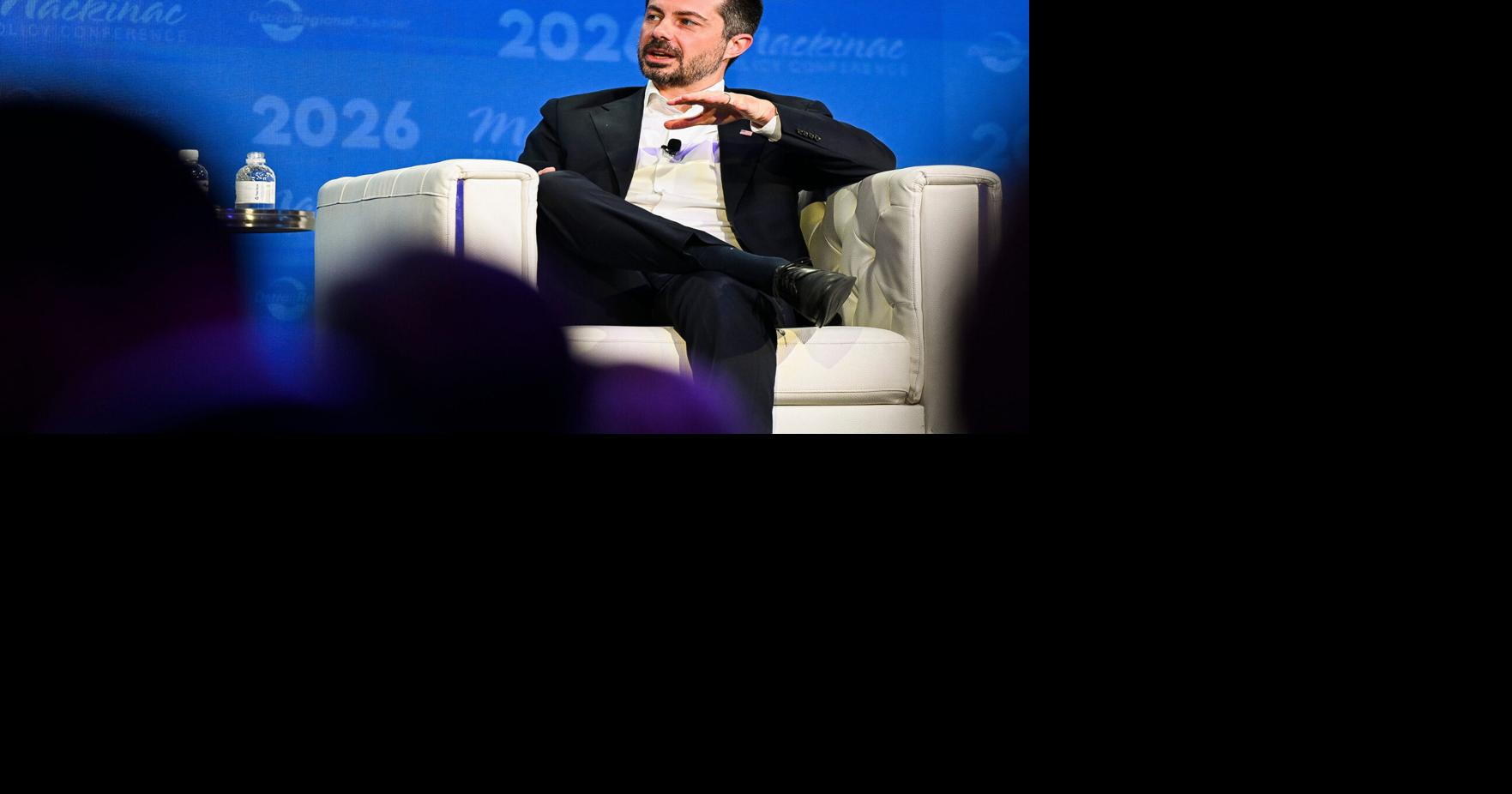 Former U.S. Transporation Secretary Pete Buttigieg chats with Detroit Regional Chamber CEO Sandy Baruah on stage during the Mackinac Police Conference on Wednesday, May 27, 2026, on Mackinac Island, Michigan.