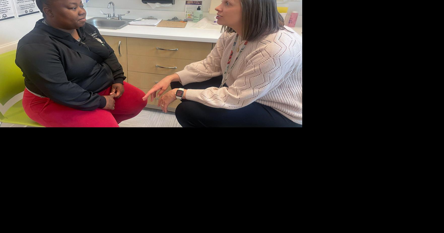 Jessica Norton, an OB-GYN with Affinia Healthcare in St. Louis, speaks with patient Candis Quinn on April 7, 2026.