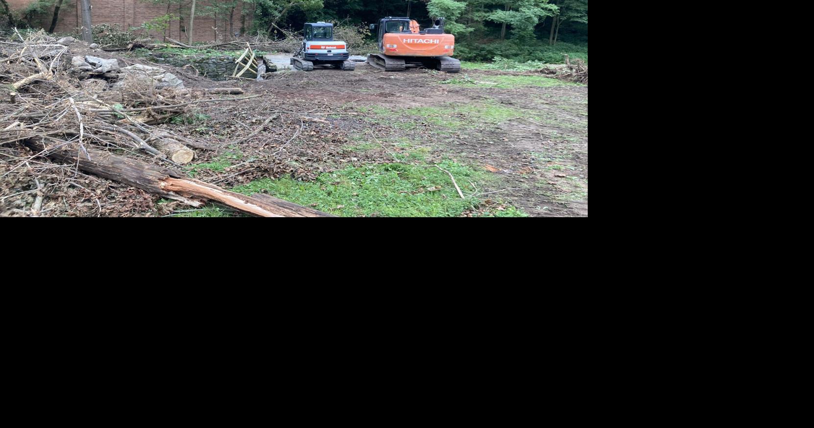 Amsterdam clearing collapsing bridge slab from Bunn Creek
