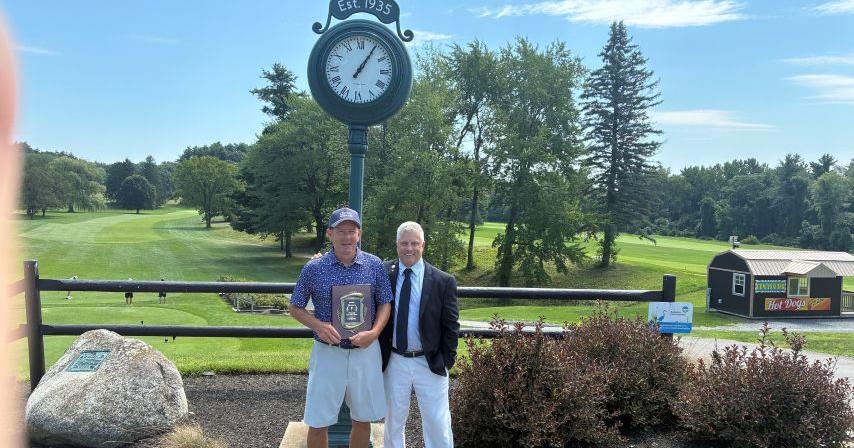 Paul Hart with plaque