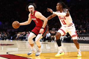 Bulls try to hand game to Heat, who refuse to take it in humbling 125-118 loss