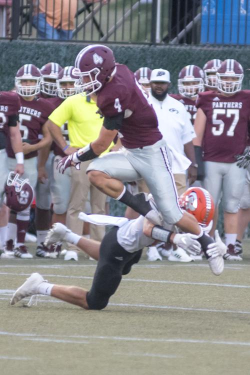 Cody Raines slips a Raceland tackle attempt.JPG