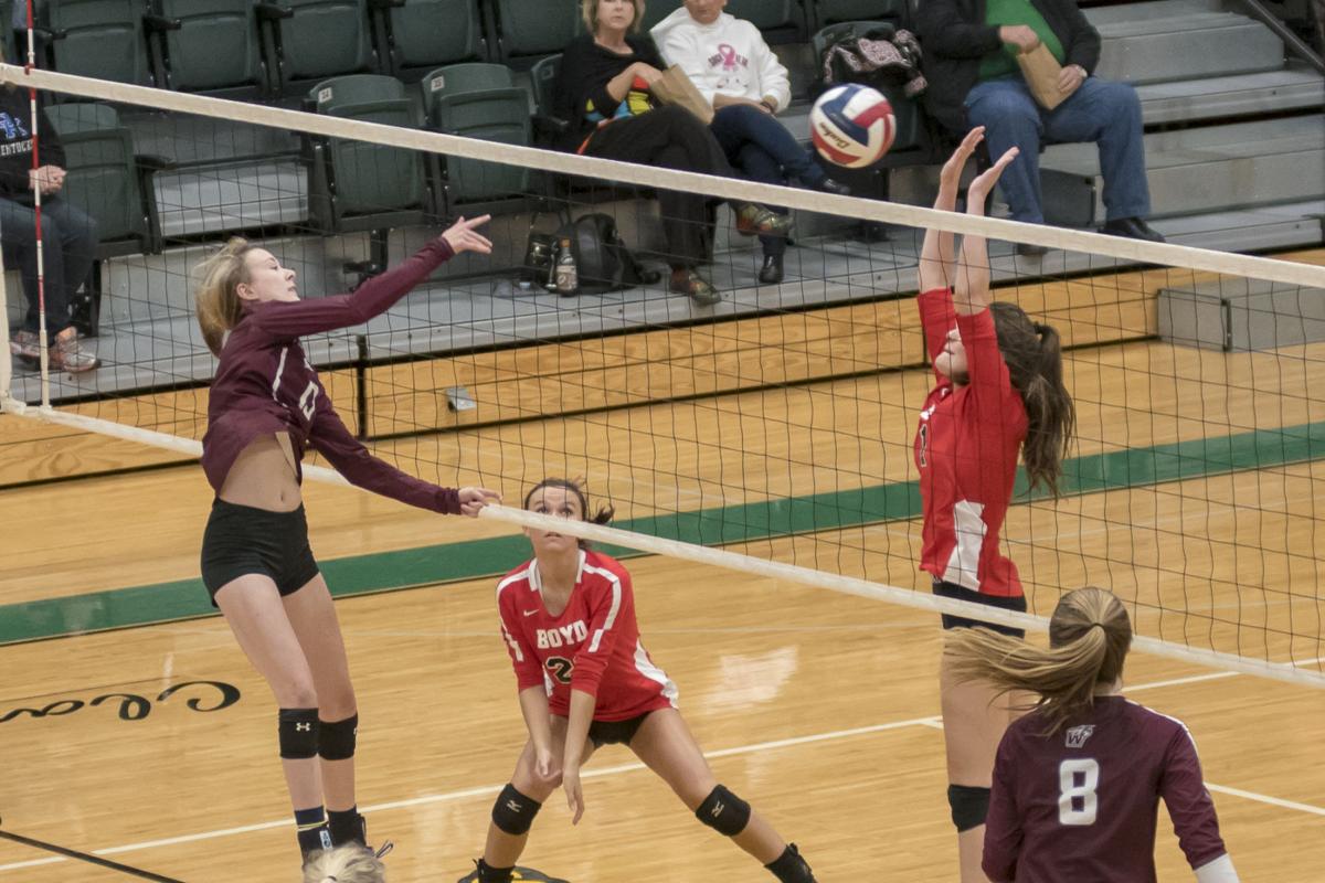Emily Adkins with a big swing at the net for West Carter.JPG