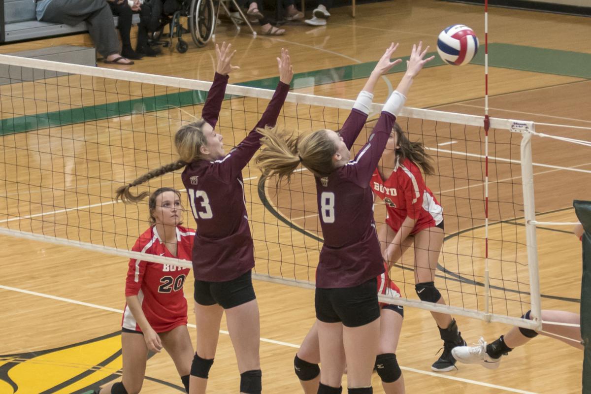 Madison Adkins and Emily Adkins work the block for West.JPG