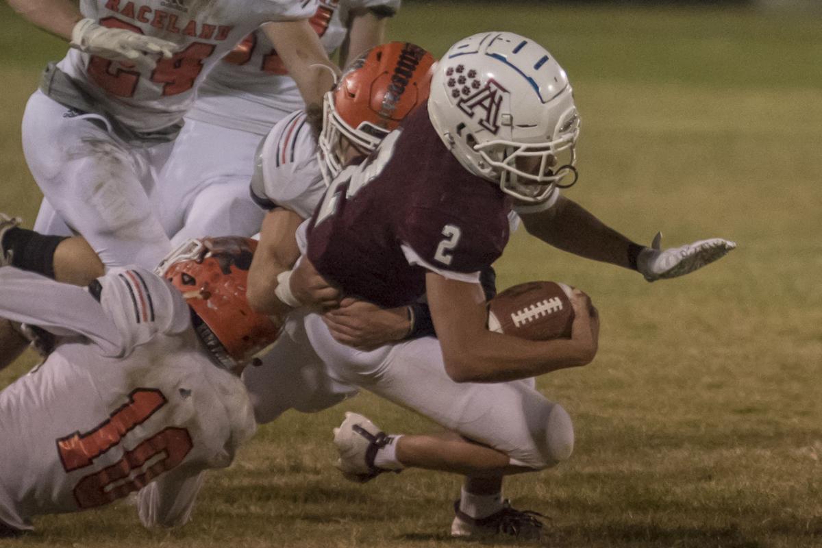 Keonate Pittman gets swallowed up by a group of Rams tacklers.JPG