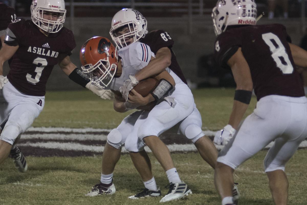 Connor Hughes gets wrapped up by Andy Layne.JPG