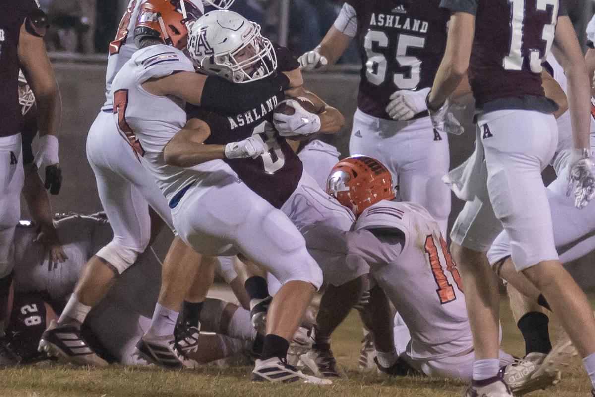 Blake Hester fights for yardage as Hunter Correll makes the stop.JPG