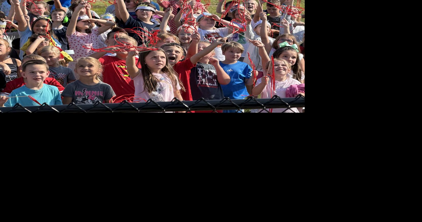 May the Tigers play: Cannonsburg Elementary cuts ribbon on new playground
