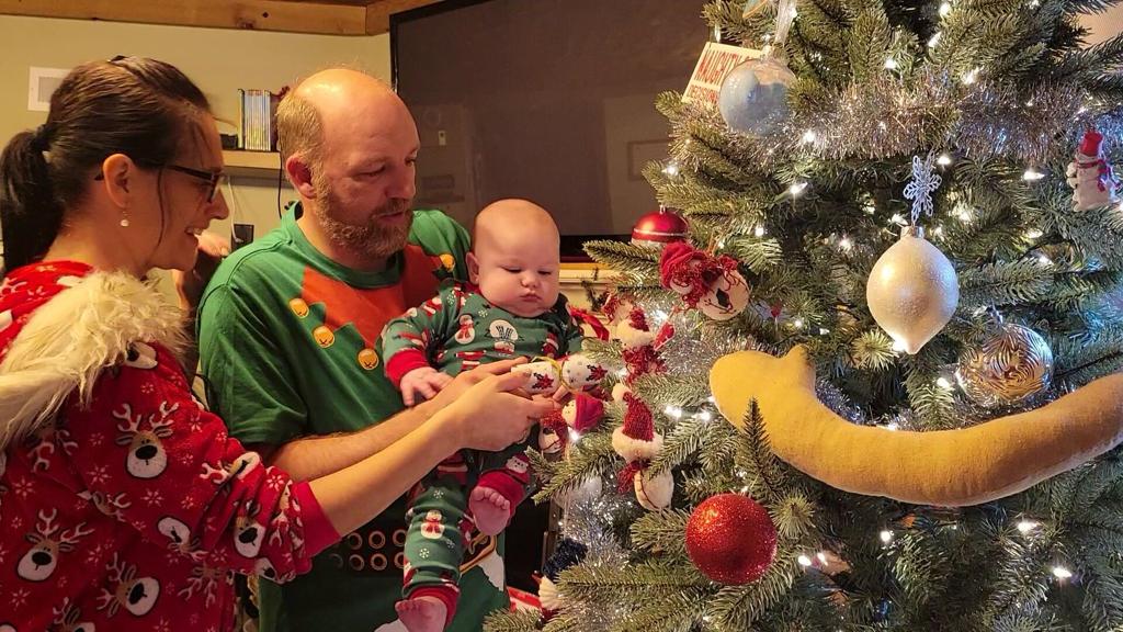 Angela and Roy Heddings celebrate first Christmas with newly adopted son
