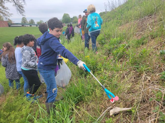 Fifthgraders carry on class tradition of helping environment for Earth
