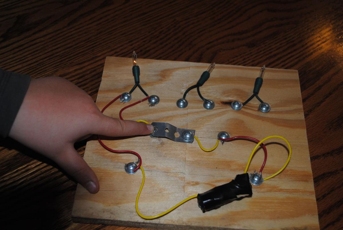 Kids build circuit with basic materials News