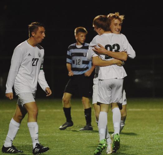 H.S. Boys Soccer Dragons use their heads to claim title Sports