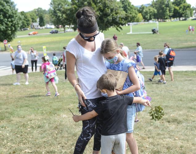 A different world Students, parents, faculty returning for a school