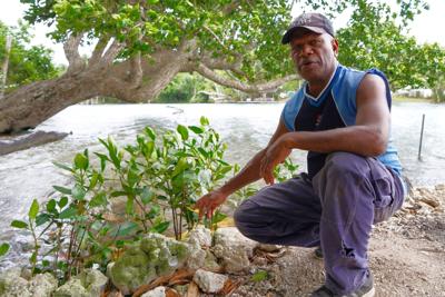 Community clean-up day latest effort to ensure healthy environment in Erakor Bridge Community