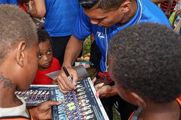 Auckland football players share experiences with children
