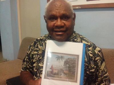 Daniel Nomorinu with the photo of Prison Homestead