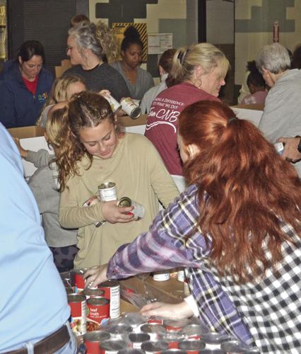 Local volunteers bring Christmas cheer with food boxes | News ...