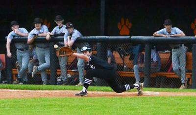 Meigs' Briar Roberts stretch at first vs. Oakdale