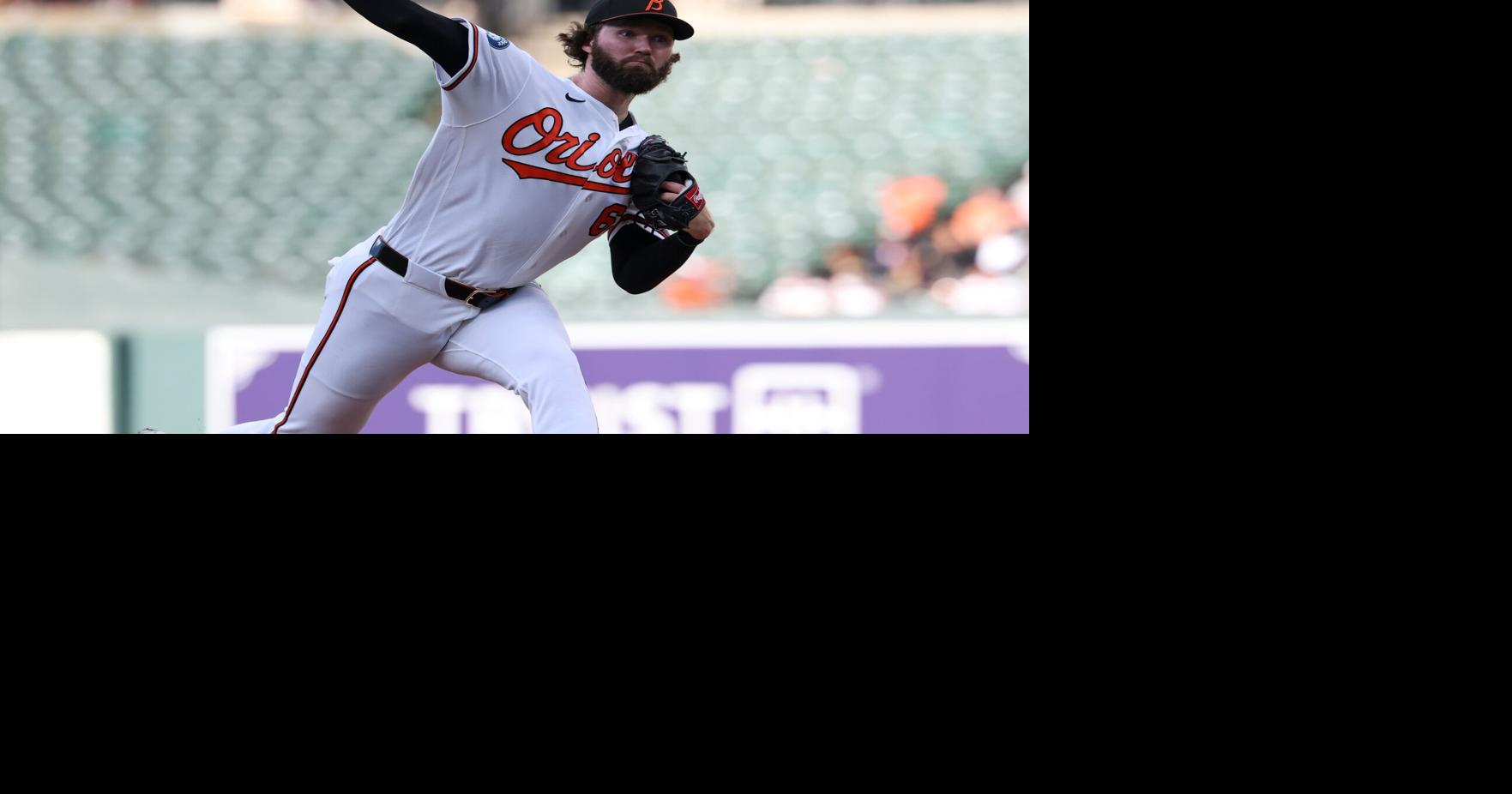 Holliday hits grand slam and Young pitches Orioles past Mariners 7-2 to stop 4-game slide