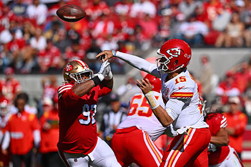 San Francisco 49ers' Bryant Young celebrates a sack against the