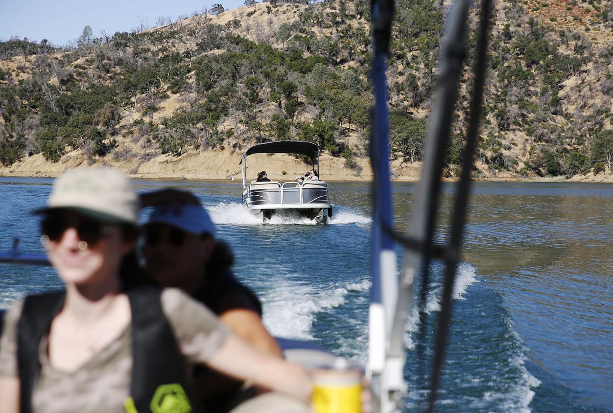 A boat moves along Lake Berryessa, Aug. 1, 2024.