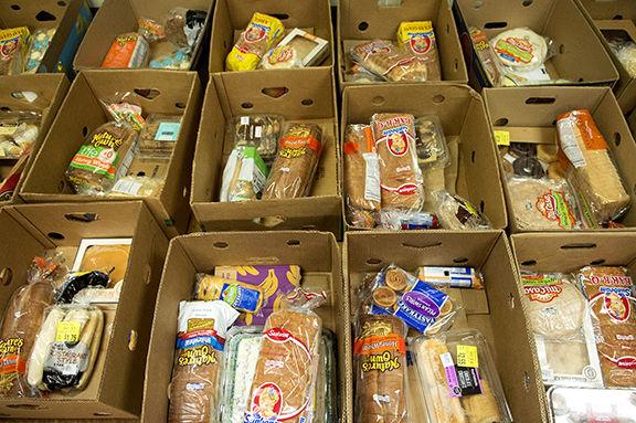 Volunteers Preparing Boxes Of Food At The Douglass Food Pantry At