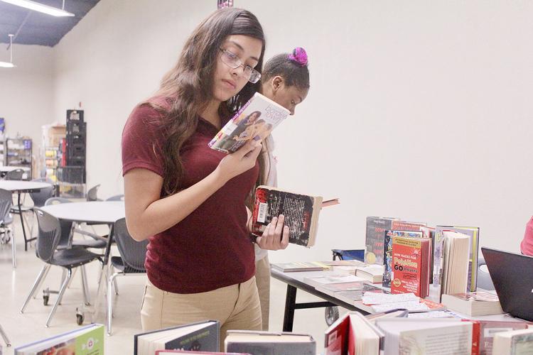 Public library hits road to fill void, create readers at Malcolm Rector