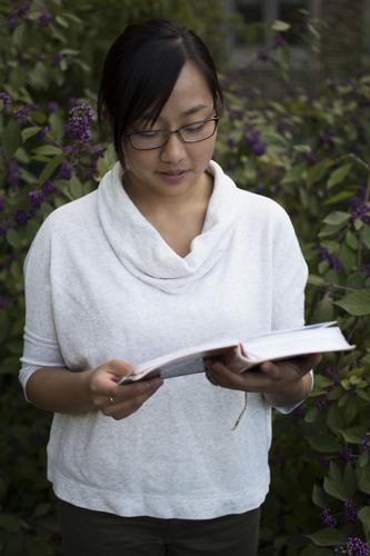 Stella Lao holding bible