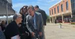Bill Gates, co-founder of Microsoft, talks to an attendee at the dedication of the Mark and Paula Hurd NCR Archive Center