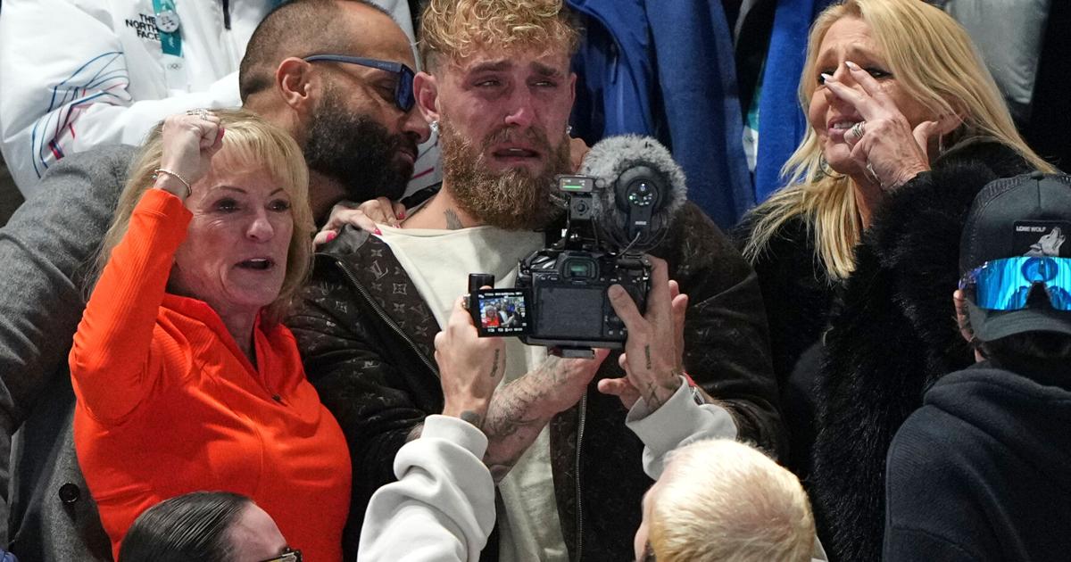 Jake Paul cheers from the second row as his fiancée, Jutta Leerdam, wins Olympic speedskating gold