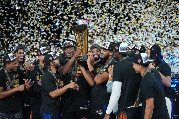 The New York Knicks celebrate after winning the NBA Cup final at T-Mobile Arena.