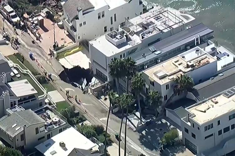 A sinkhole is seen along a stretch of coastline in Malibu