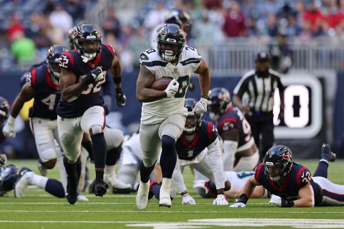 Seattle Seahawks running back Rashaad Penny breaks off a 47- yard touchdown run during the fourth quarter against the Houston Texans at NRG Stadium on Dec. 12, 2021, in Houston.