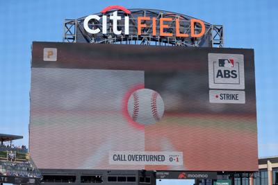 An overturned call displayed on the scoreboard at Citi Field.