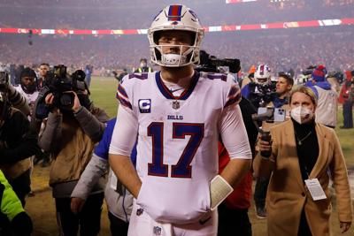 Buffalo Bills quarterback Josh Allen walks off the field after a 42-36 loss against the Kansas City Chiefs in the AFC Divisional Playoff game at Arrowhead Stadium on Jan. 23, 2022, in Kansas City, Missouri.