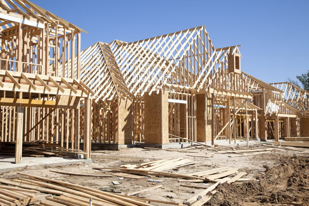 New homes construction site. Framed houses. Lumber. Building.