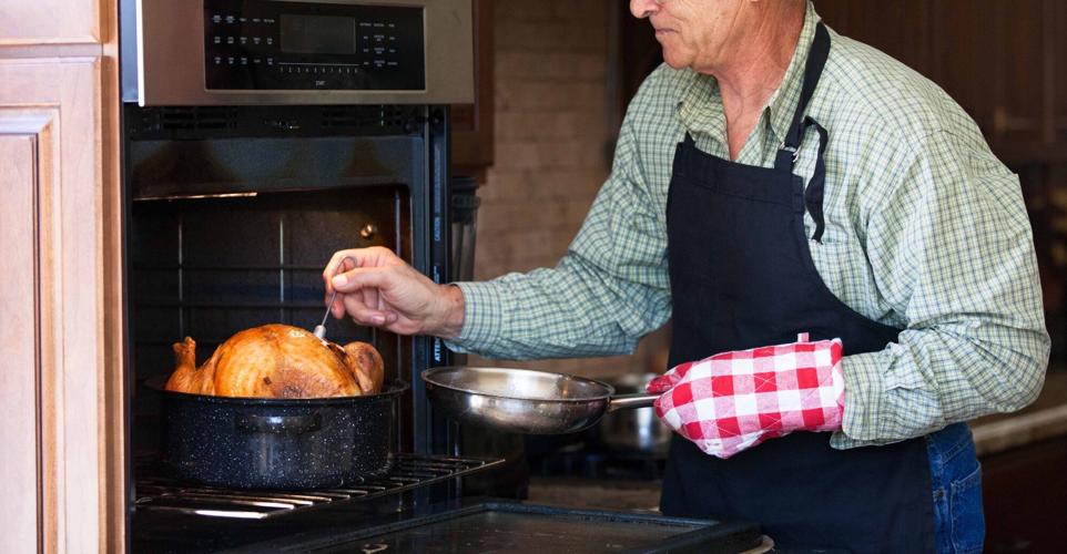 Basting a baking turkey