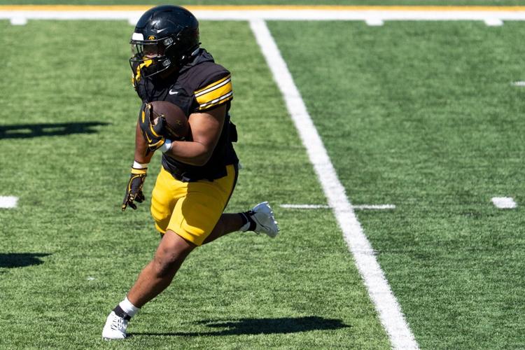 Iowa running back Lendon Phillips Jr. (21) carries the ball April 25, 2026 during the team’s spring practice at Kinnick Stadium