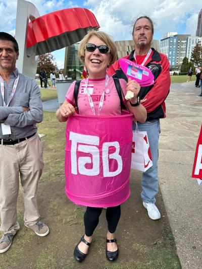 Jenny Boyter, a retired school administrator from Buckhead, wears a TaB outfit at a "Save TaB" gathering outside the World of Coke on Oct. 20, 2023.