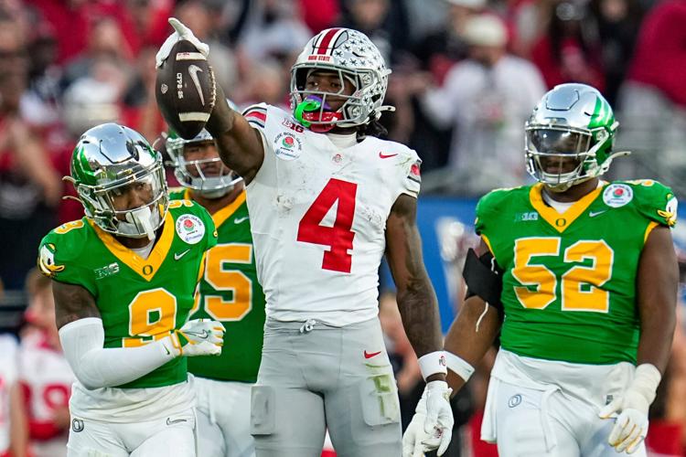 Ohio State wide receiver Jeremiah Smith (4) celebrates a first down against Oregon during College Football Playoff quarterfinal at the 2025 Rose Bowl.