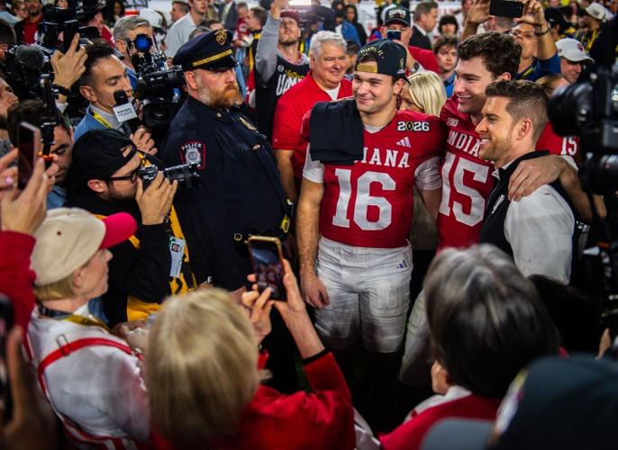 Indiana's Fernando Mendoza (15) and Alberto Mendoza (16) pose with family as they celebrates after the College Football Playoff National Championship college football game at Hard Rock Stadium in Miami Gardens on Monday, Jan. 19, 2026.