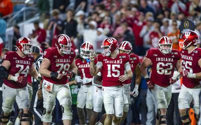 Indiana quarterback Fernando Mendoza lets teammates know a few kneel downs and they defeat the University of Miami during the second half of the College Football Playoff national championship game at Hard Rock Stadium on Jan. 19, 2026, in Miami Gardens,...