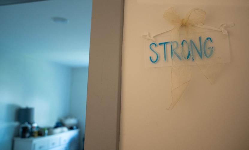 The word “strong” is pinned outside Denise Anderson’s bedroom at Ella's House in Nashville on Friday, April 3, 2026. Anderson is