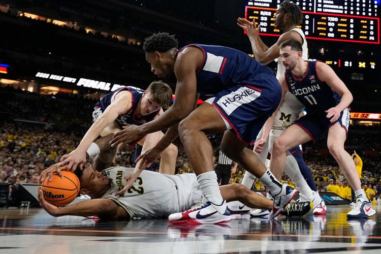 APTOPIX NCAA UConn Michigan Basketball