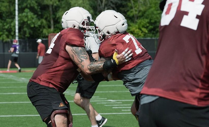 Iowa State offensive lines Gavin Broscious (74) and Jake Taylor (79) block during the university’s football open practice at