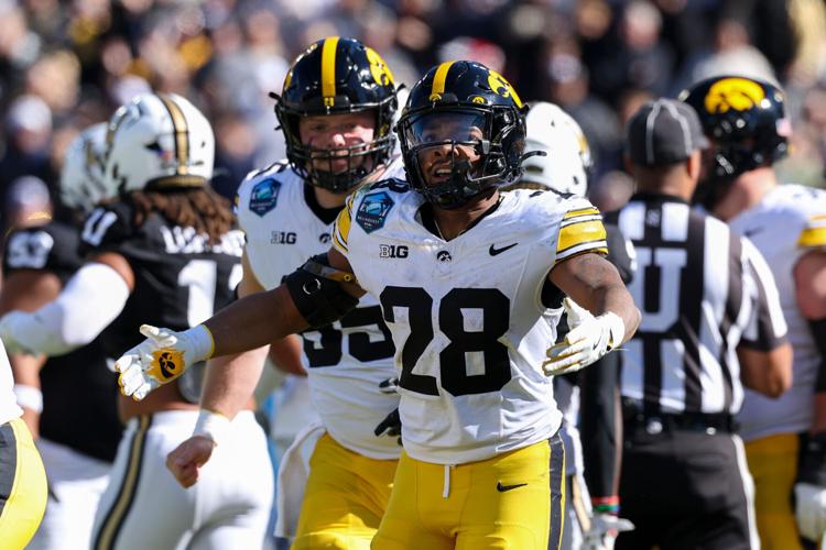 Dec 31, 2025; Tampa, FL, USA; Iowa Hawkeyes running back Kamari Moulton (28) reacts after a touchdown against the Vanderbilt Commodores in the first quarter during the ReliaQuest Bowl at Raymond James Stadium. Mandatory Credit: Nathan Ray Seebeck-Imagn Ima